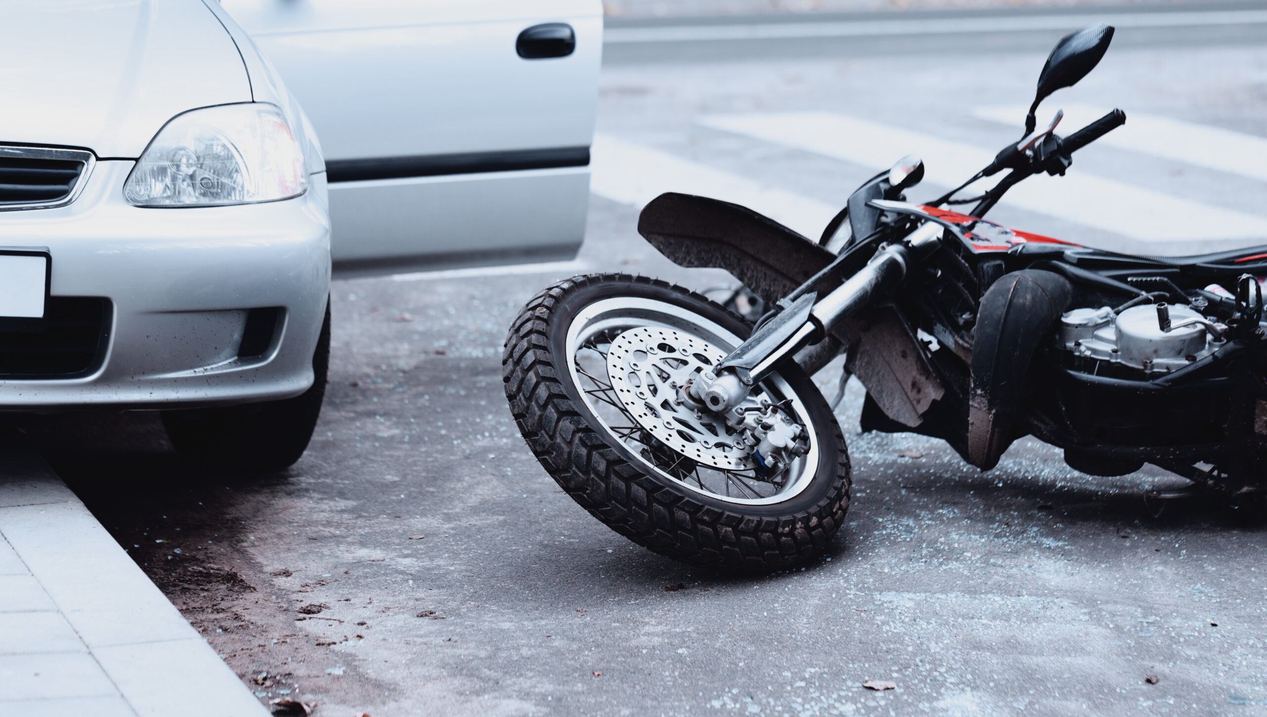 Motorcycle,Lying,On,The,Road,And,Car,Standing,With,Open